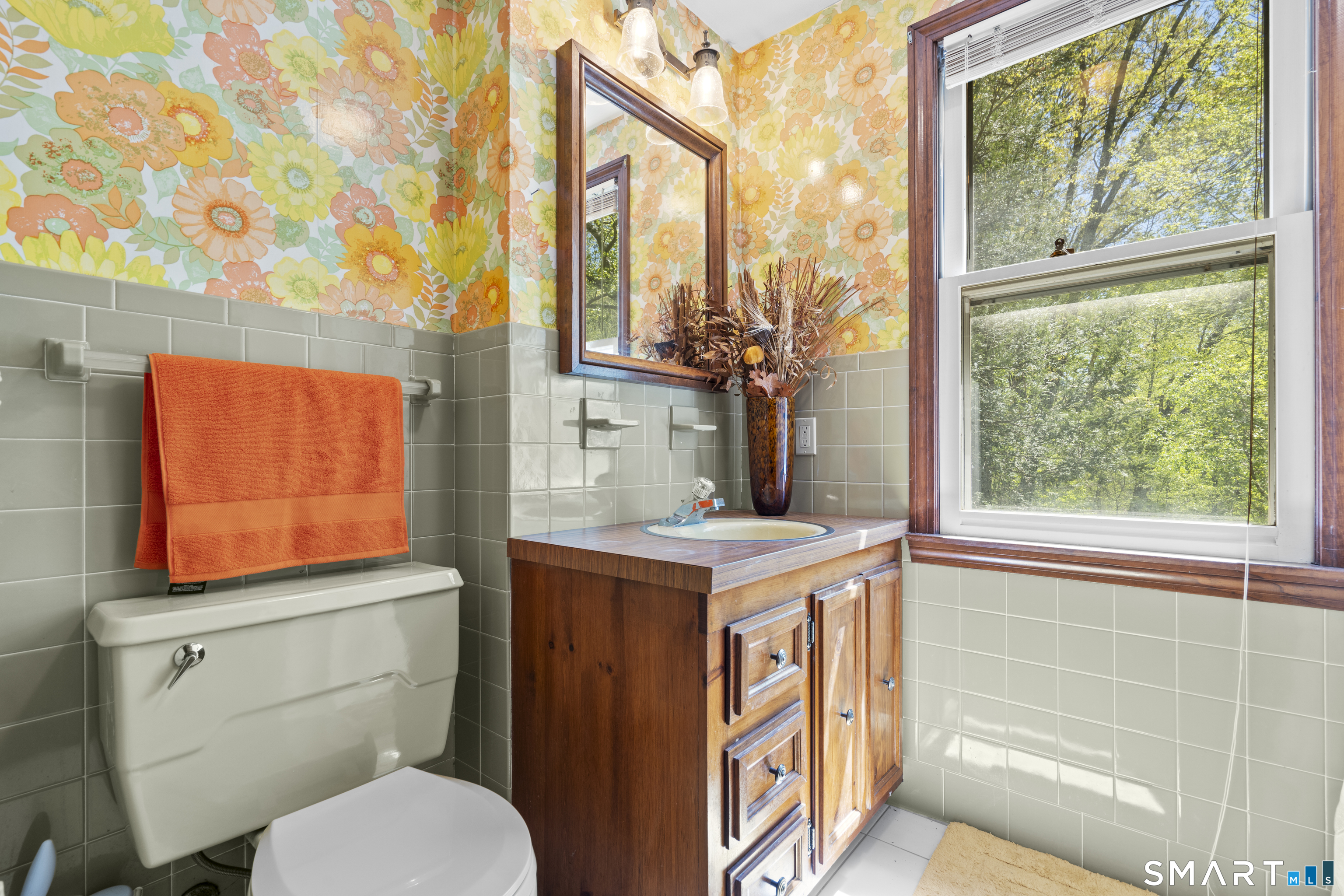 81 Meeting House Road Haddam, CT 06438 - Photo 18 of 35 a bathroom with a toilet sink and mirror