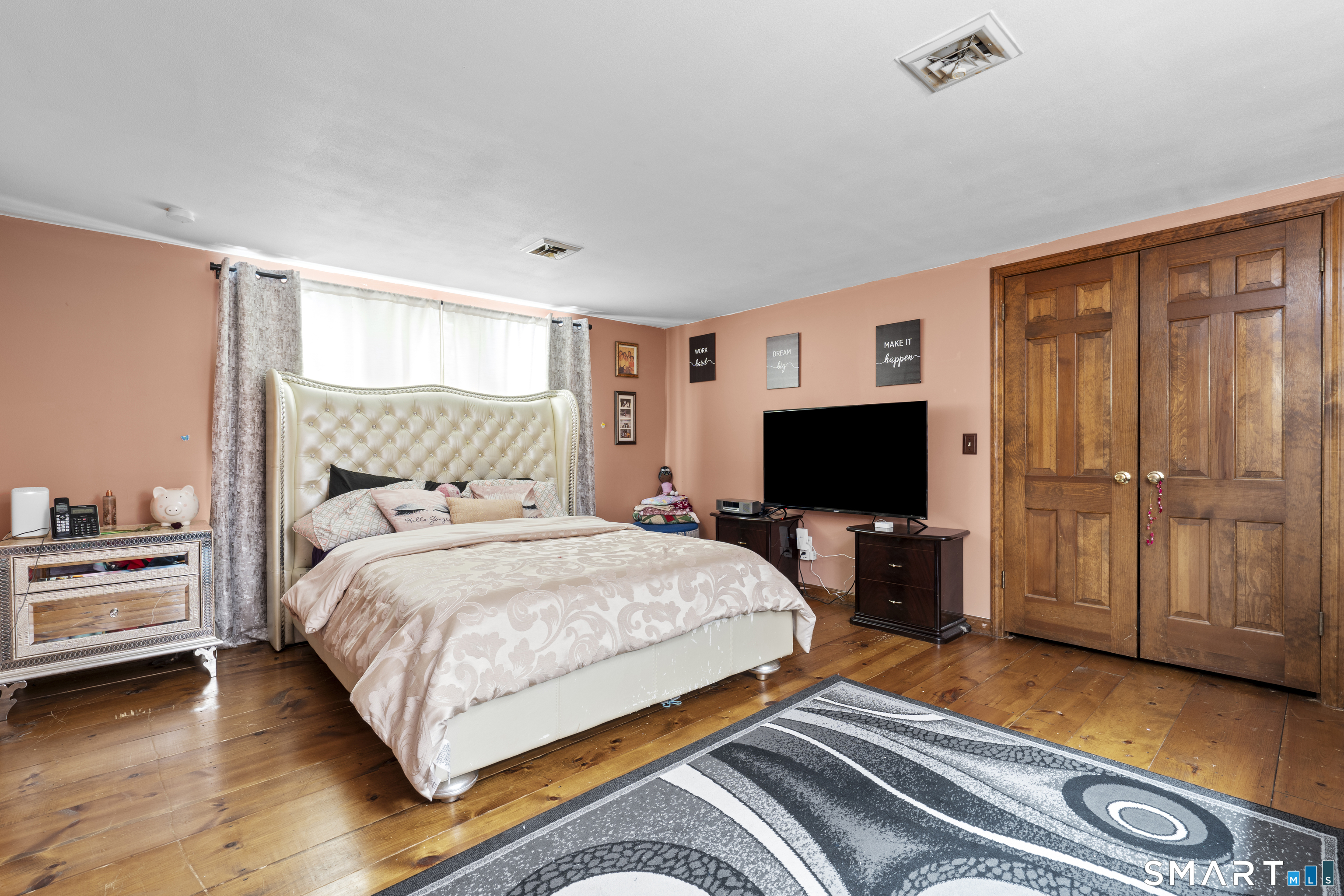 81 Meeting House Road Haddam, CT 06438 - Photo 23 of 35 a bedroom with a bed and a flat screen tv