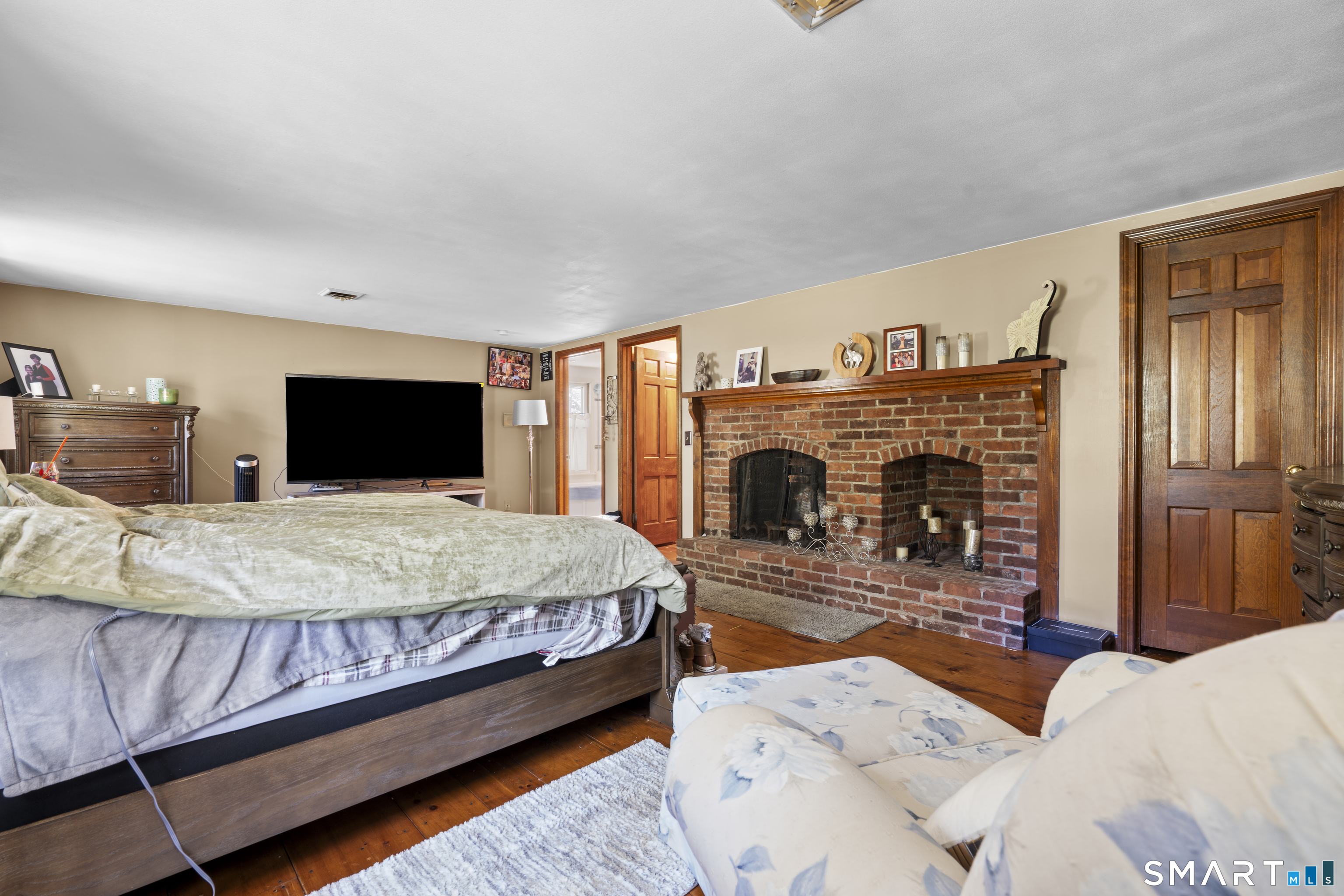 81 Meeting House Road Haddam, CT 06438 - Photo 25 of 35 a bed room with a bed and a television
