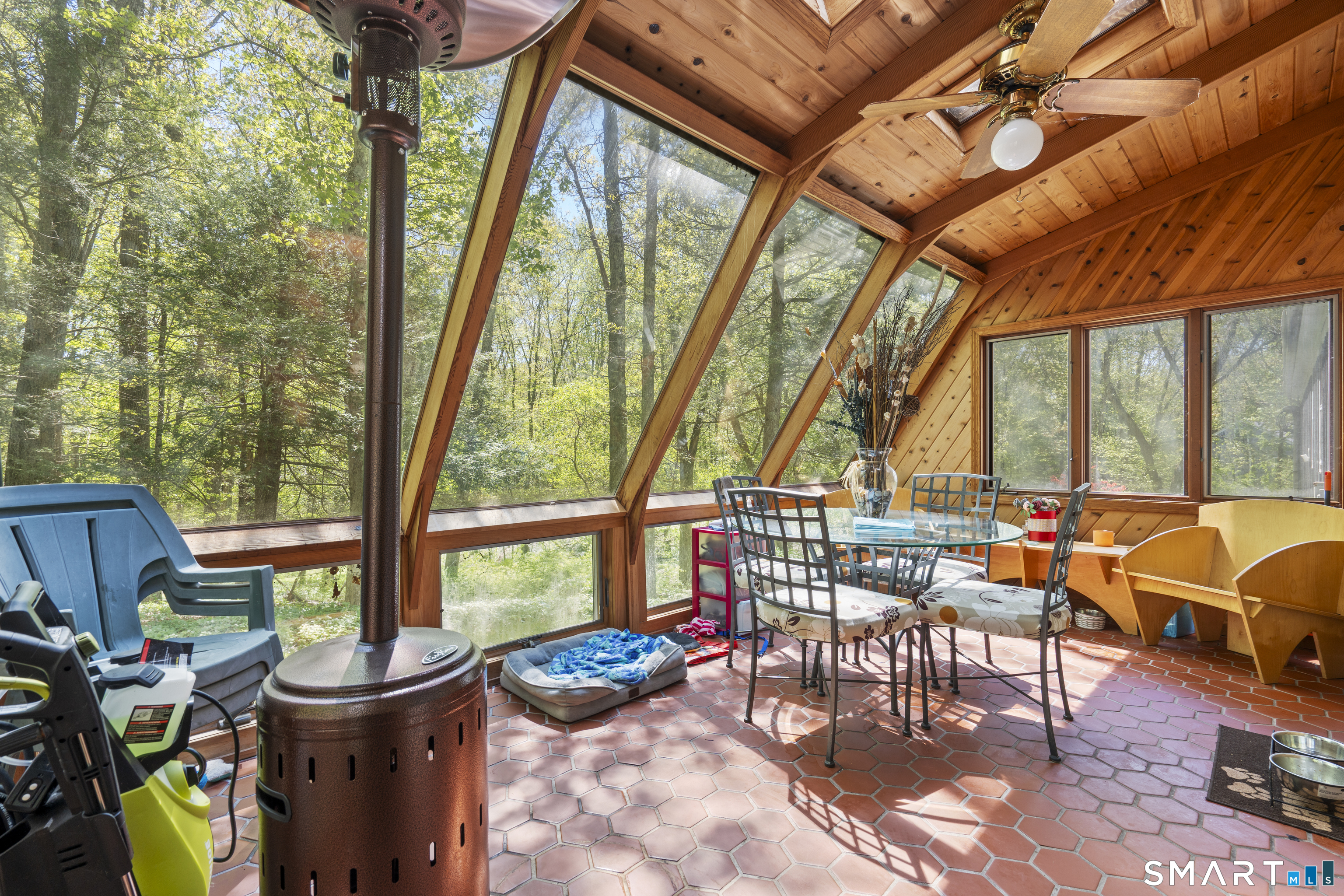 81 Meeting House Road Haddam, CT 06438 - Photo 26 of 35 a view of a patio with chairs and floor to ceiling window