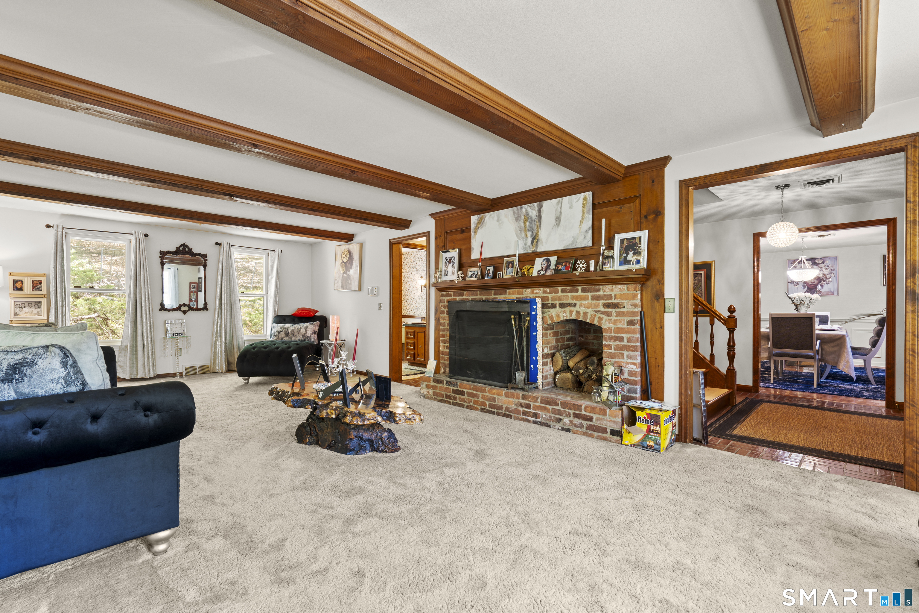 81 Meeting House Road Haddam, CT 06438 - Photo 7 of 35 a living room with furniture a fireplace and a flat screen tv