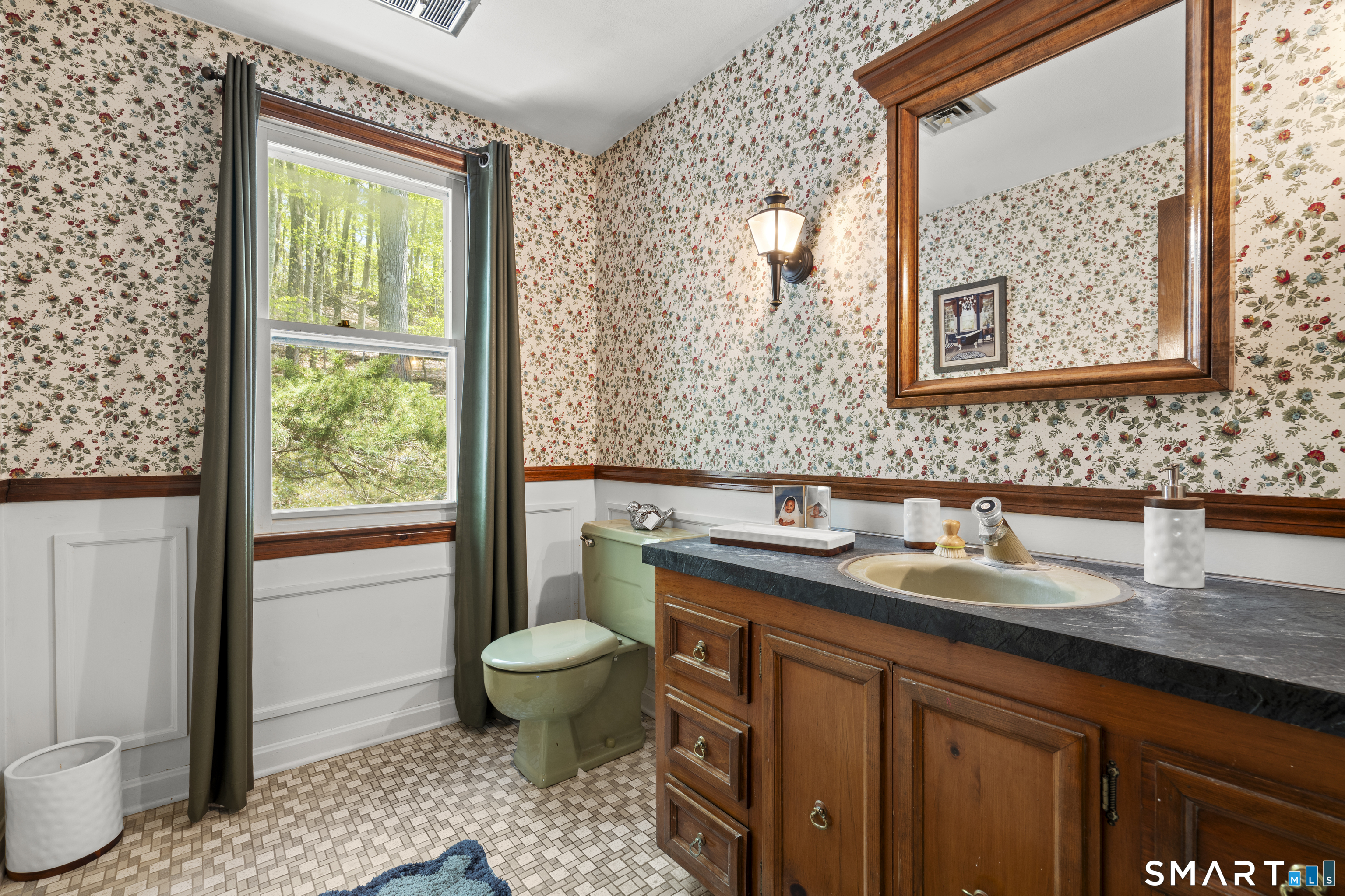 81 Meeting House Road Haddam, CT 06438 - Photo 9 of 35 a bathroom with a granite countertop sink a toilet and a mirror