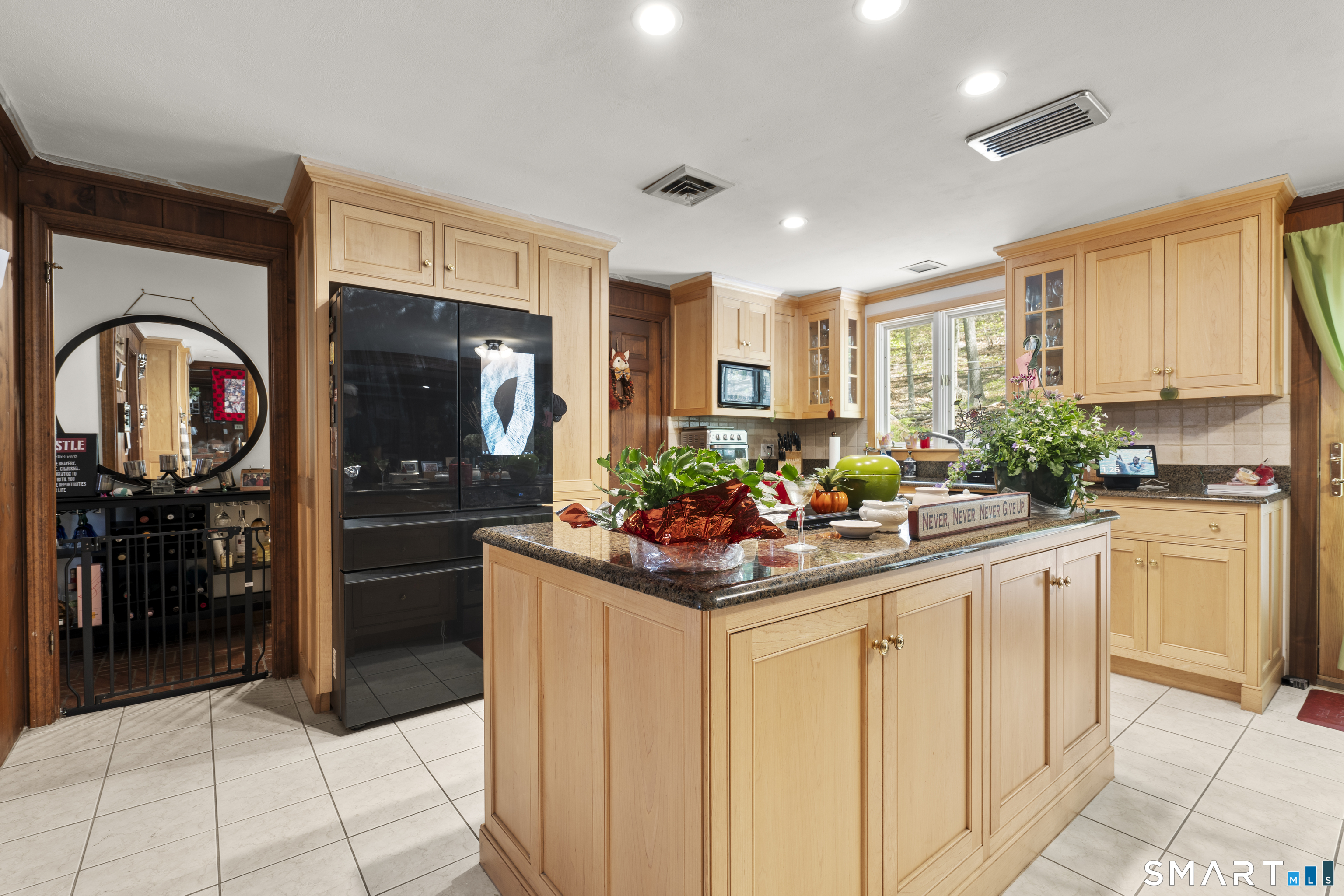 81 Meeting House Road Haddam, CT 06438 - Photo 10 of 35 a kitchen with stainless steel appliances kitchen island granite countertop a refrigerator and a sink