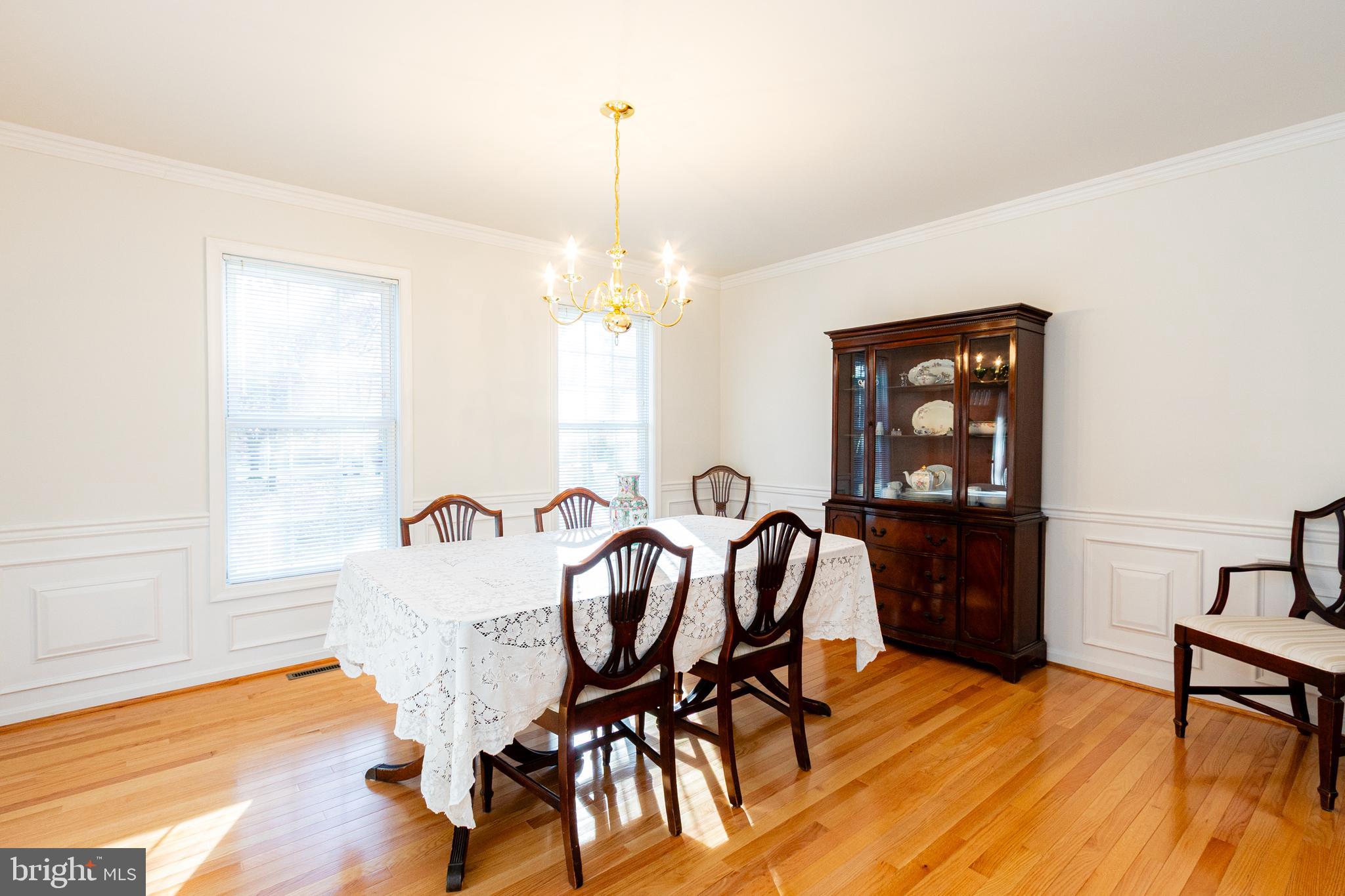 20753 Chestnut Ridge Drive Leonardtown, MD 20650 - Photo 11 of 45 a view of a dining room with furniture and wooden floor