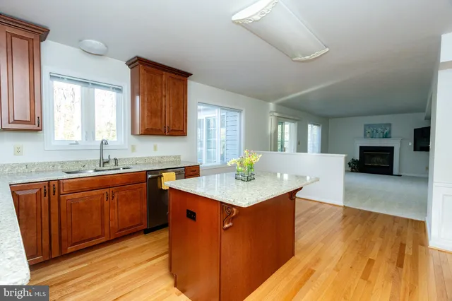 a bedroom with a bed and a lamp on dresser