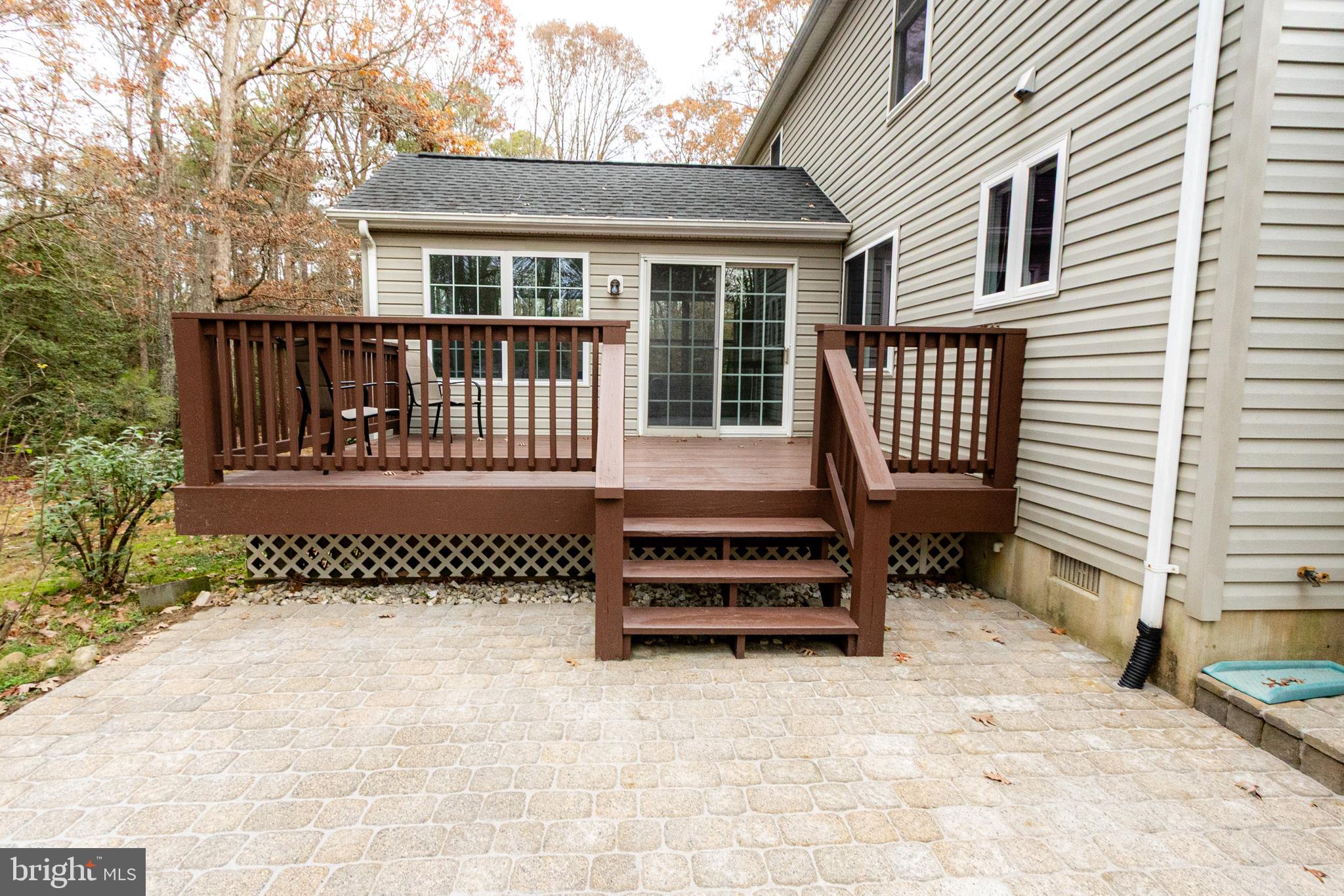 20753 Chestnut Ridge Drive Leonardtown, MD 20650 - Photo 42 of 45 an outdoor view of a house with a bench