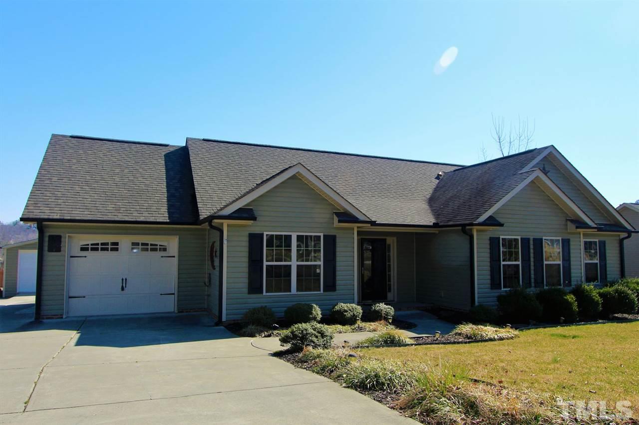 203 Orkney Road Stem, NC 27581 - Photo 1 of 30 a front view of a house with a yard