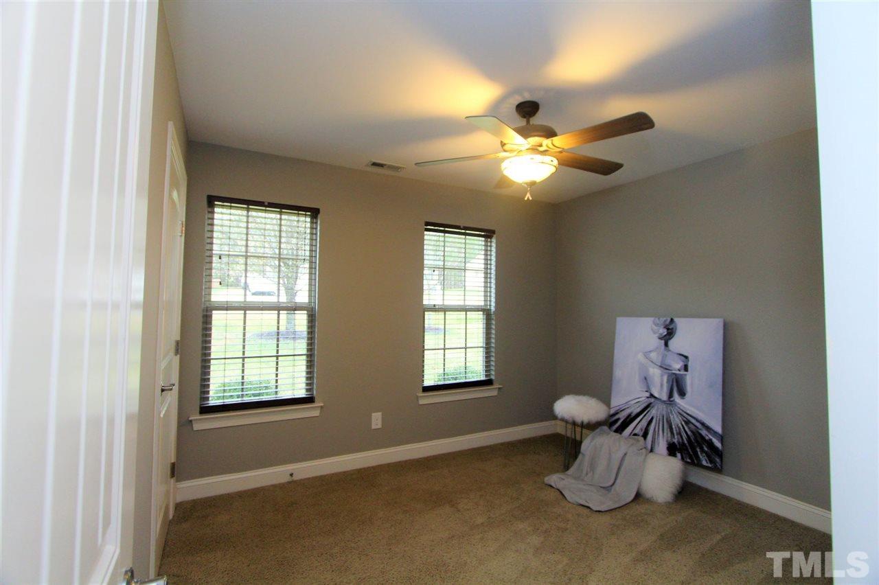 203 Orkney Road Stem, NC 27581 - Photo 21 of 30 a view of workspace with window and chandelier fan
