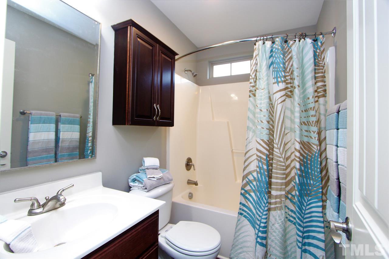 203 Orkney Road Stem, NC 27581 - Photo 22 of 30 a bathroom with a sink toilet and shower
