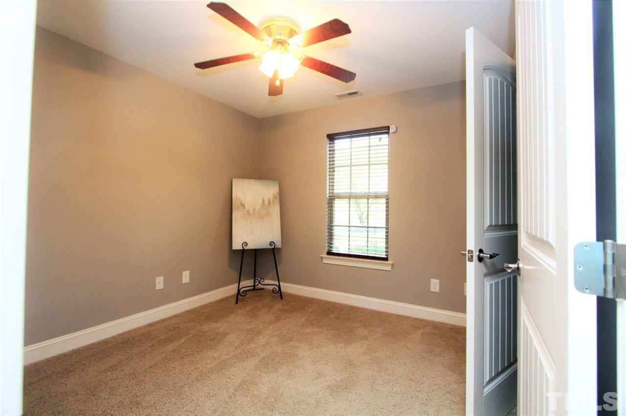203 Orkney Road Stem, NC 27581 - Photo 23 of 30 an empty room with windows and fan