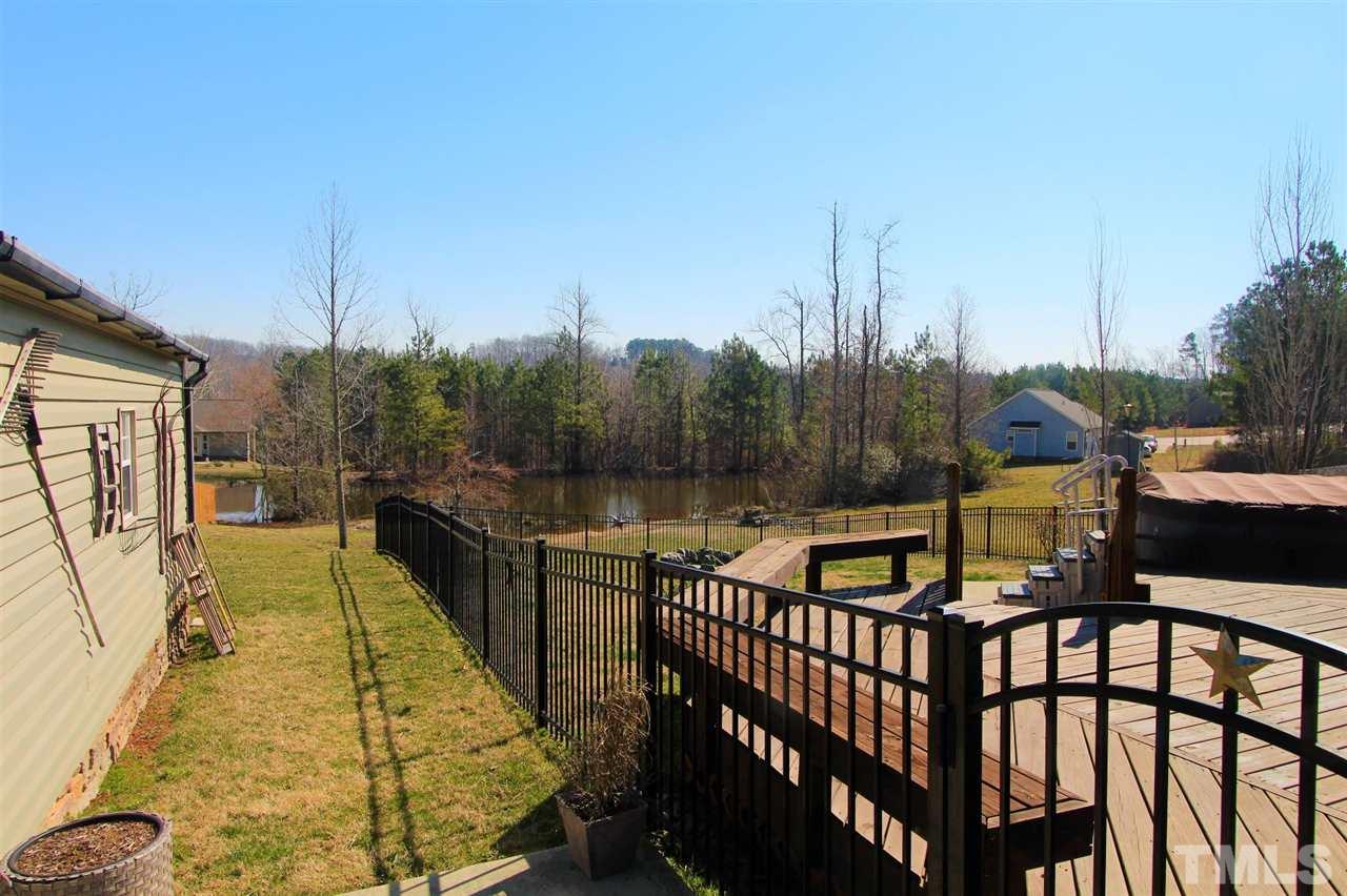 203 Orkney Road Stem, NC 27581 - Photo 25 of 30 a view of a chairs and table on the terrace