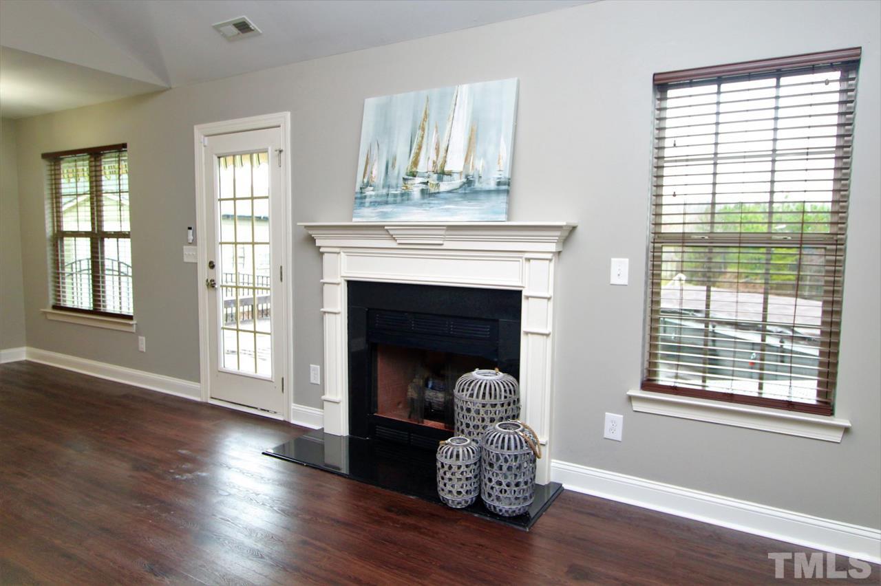 203 Orkney Road Stem, NC 27581 - Photo 9 of 30 a living room with furniture and a fireplace