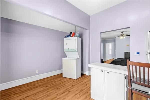 a kitchen with stainless steel appliances a stove a sink dishwasher and cabinets with wooden floor
