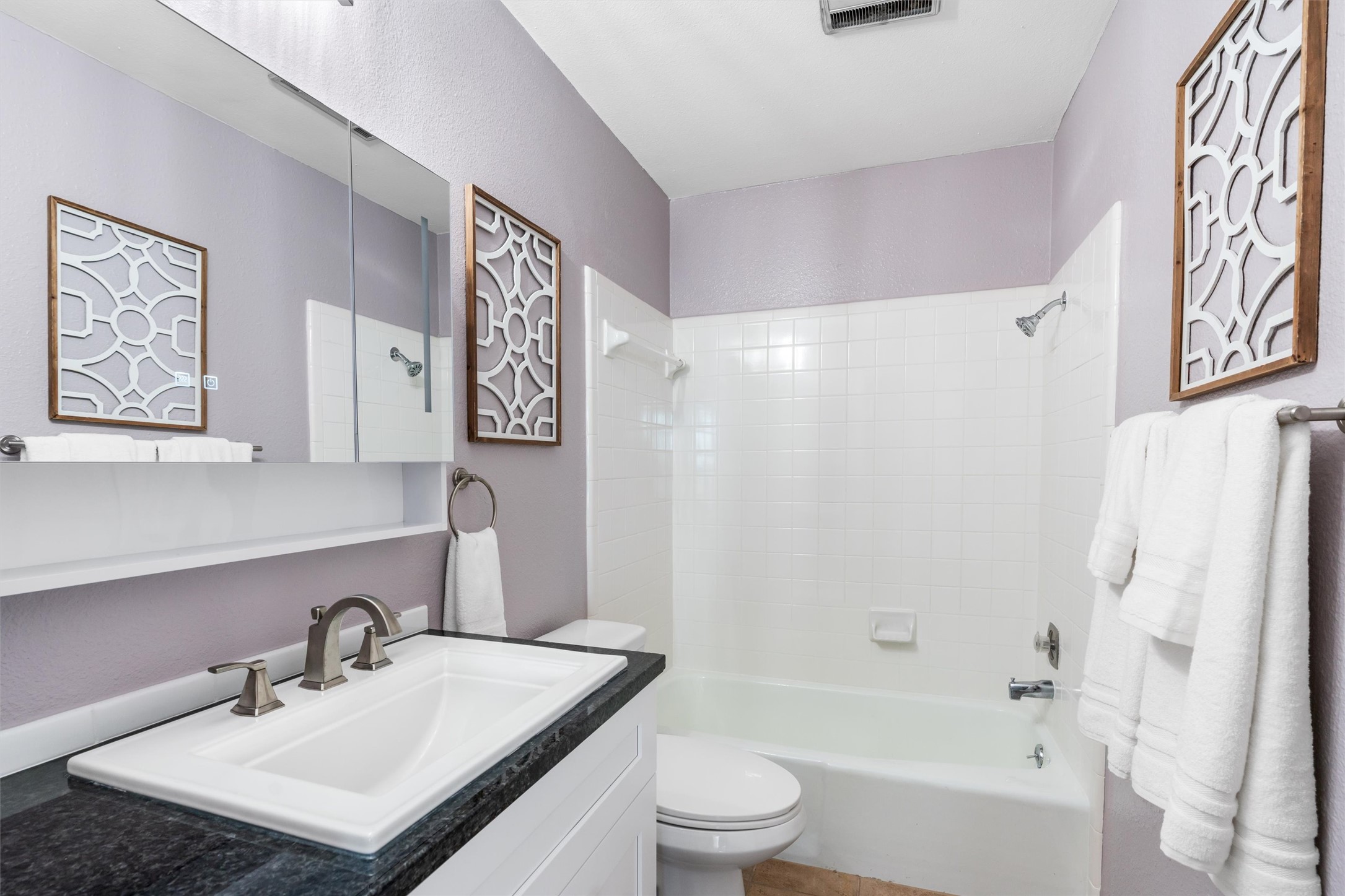 11902 Barrington Way Austin, TX 78759 - Photo 19 of 30 Second full bath featuring vanity and bathing tub / shower combination