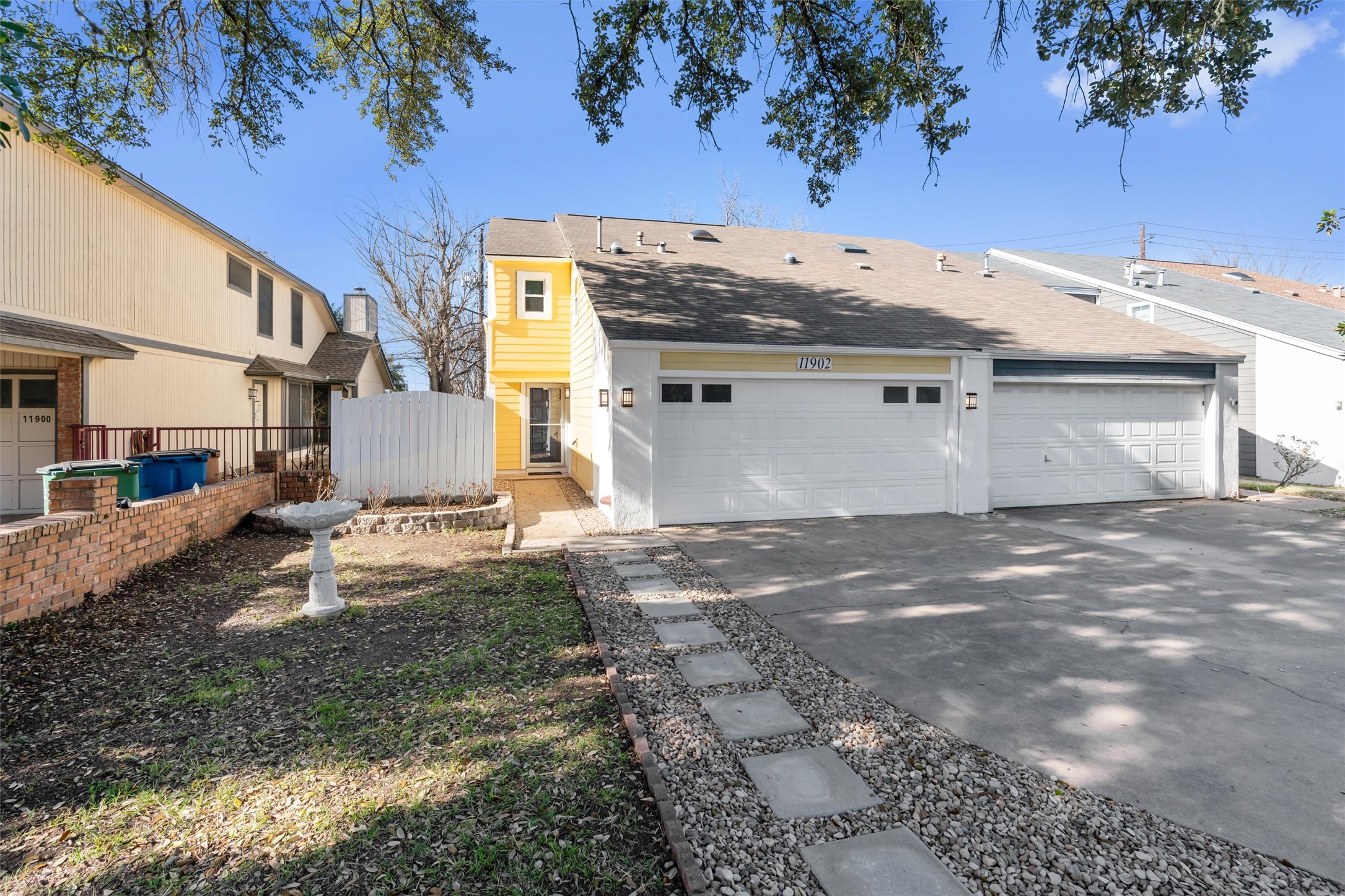 11902 Barrington Way Austin, TX 78759 - Photo 2 of 30 View of front of house with a garage and concrete driveway