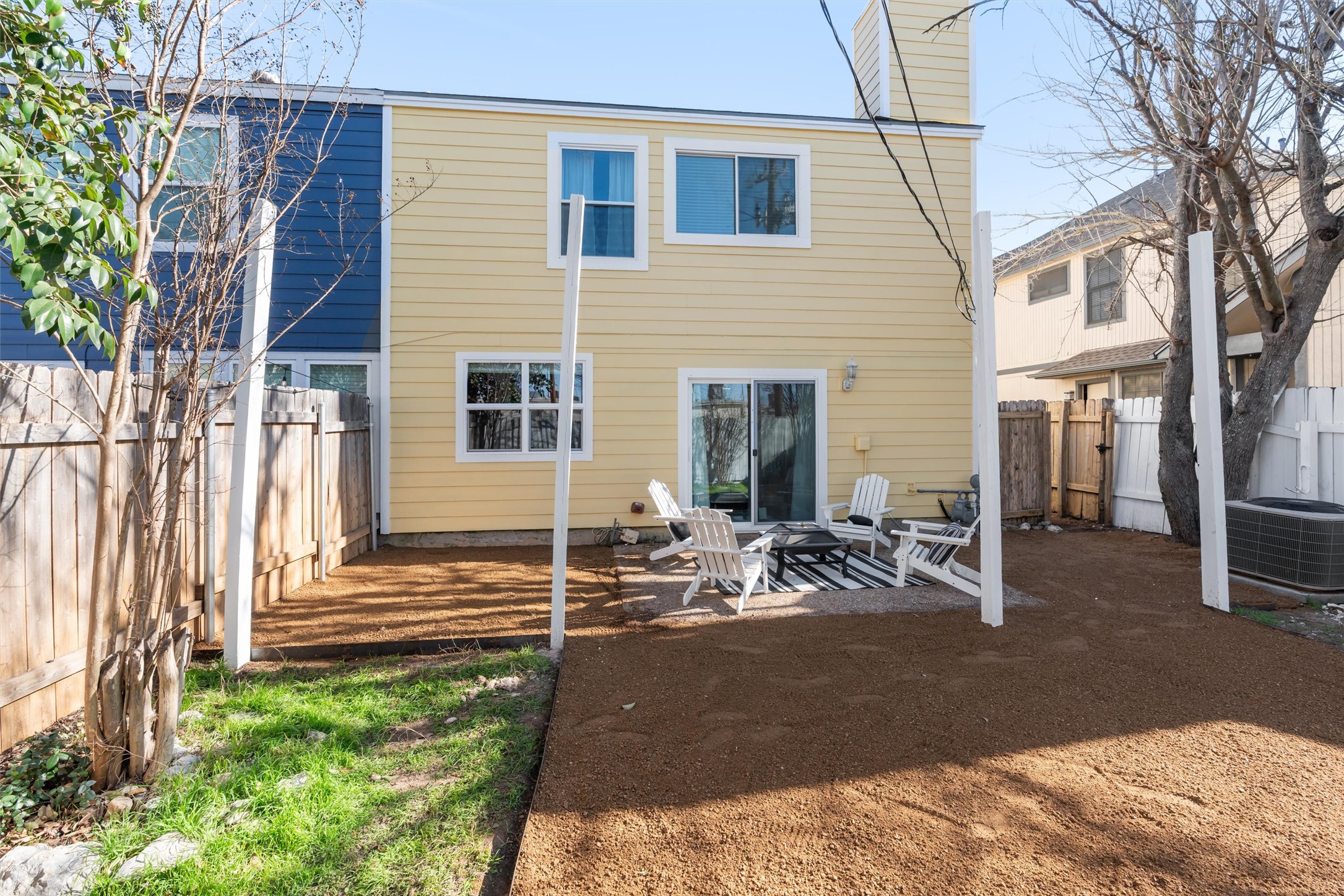 11902 Barrington Way Austin, TX 78759 - Photo 28 of 30 Rear view of house with a fenced backyard, a patio area, and a chimney