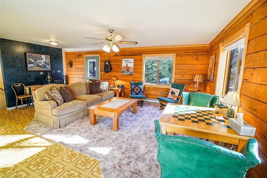 1276 South Crystal Road Lake George, CO 80827 - Photo 6 of 25 a living room with patio chairs and a large window