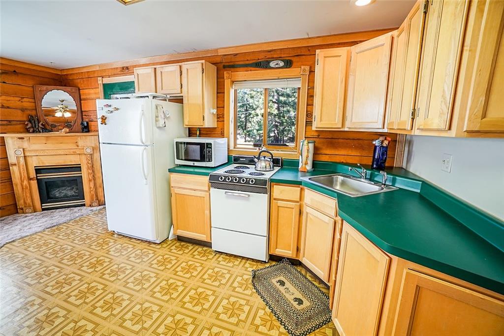 1276 South Crystal Road Lake George, CO 80827 - Photo 9 of 25 a kitchen with stainless steel appliances granite countertop a refrigerator and a stove