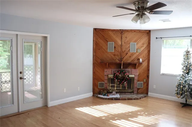 a view of a livingroom with a patio and a fireplace