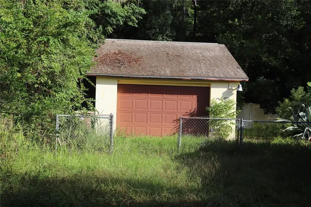 a backyard of a house with lots of green space