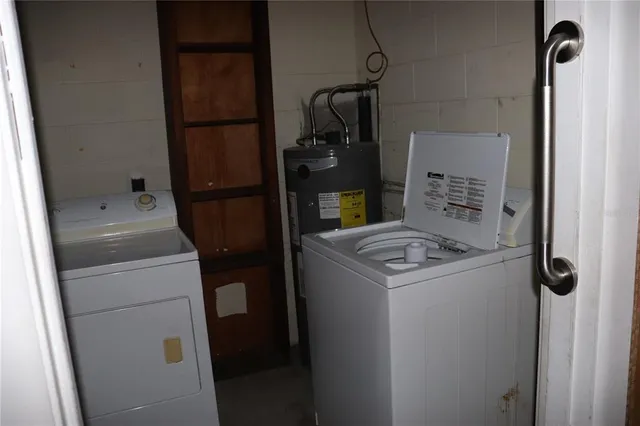 a utility room with dryer and washer