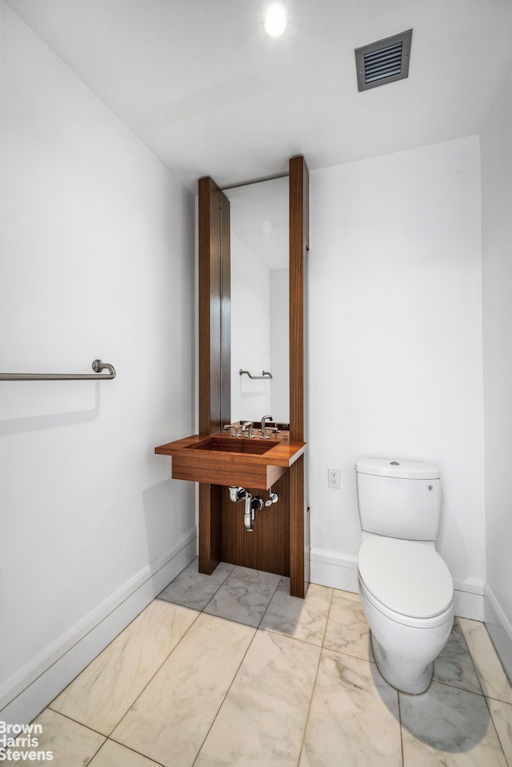 60 Riverside Boulevard, Unit 3004 Manhattan, NY 10069 - Photo 20 of 32 a room with a toilet and a sink