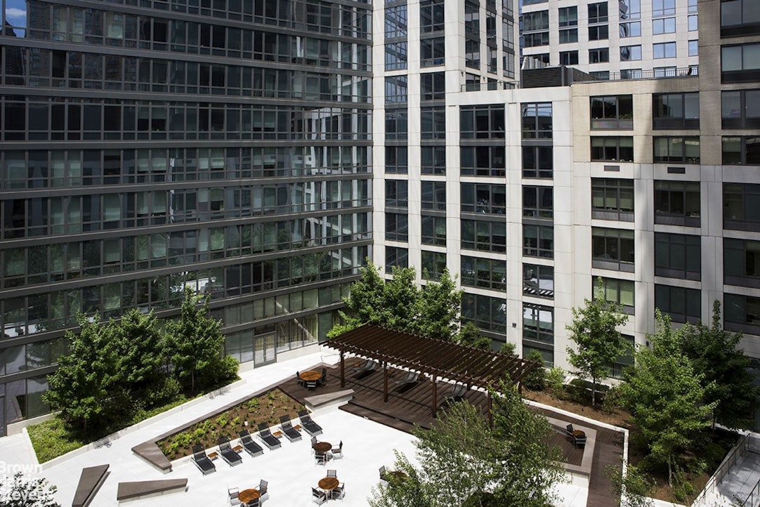 60 Riverside Boulevard, Unit 3004 Manhattan, NY 10069 - Photo 23 of 32 a view of a backyard with plants