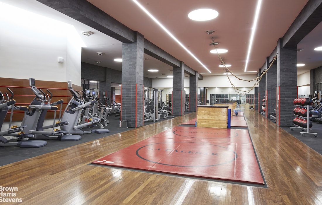 60 Riverside Boulevard, Unit 3004 Manhattan, NY 10069 - Photo 25 of 32 a view of a room with gym equipment