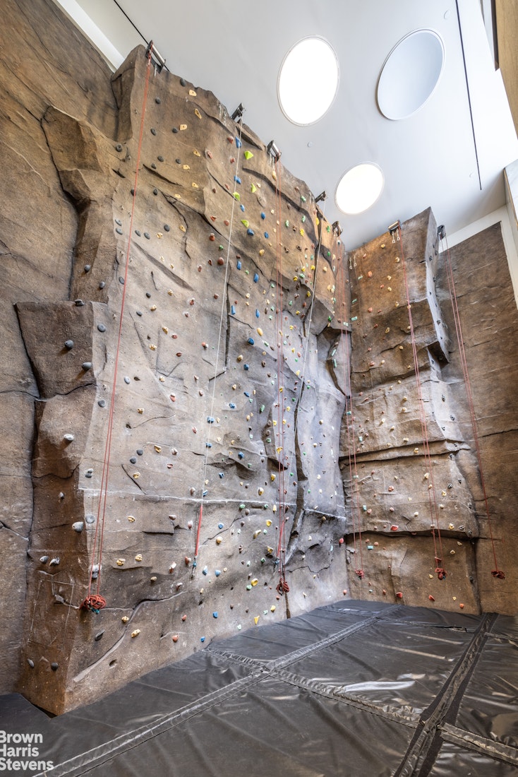 60 Riverside Boulevard, Unit 3004 Manhattan, NY 10069 - Photo 29 of 32 a view of a chandelier fan and wooden floor