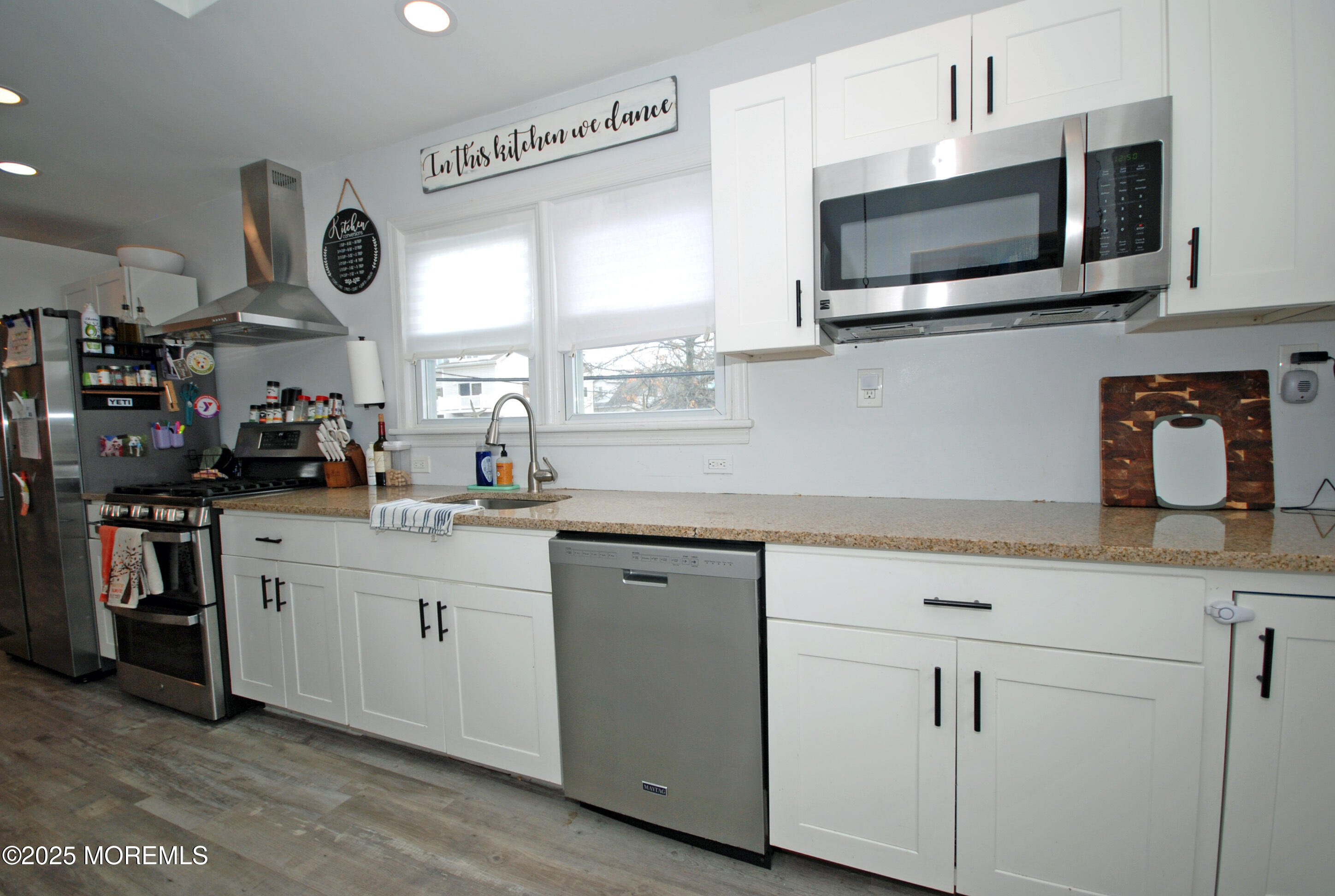 25 Beach Boulevard Highlands, NJ 07732 - Photo 14 of 32 a kitchen with stainless steel appliances granite countertop a sink and a microwave