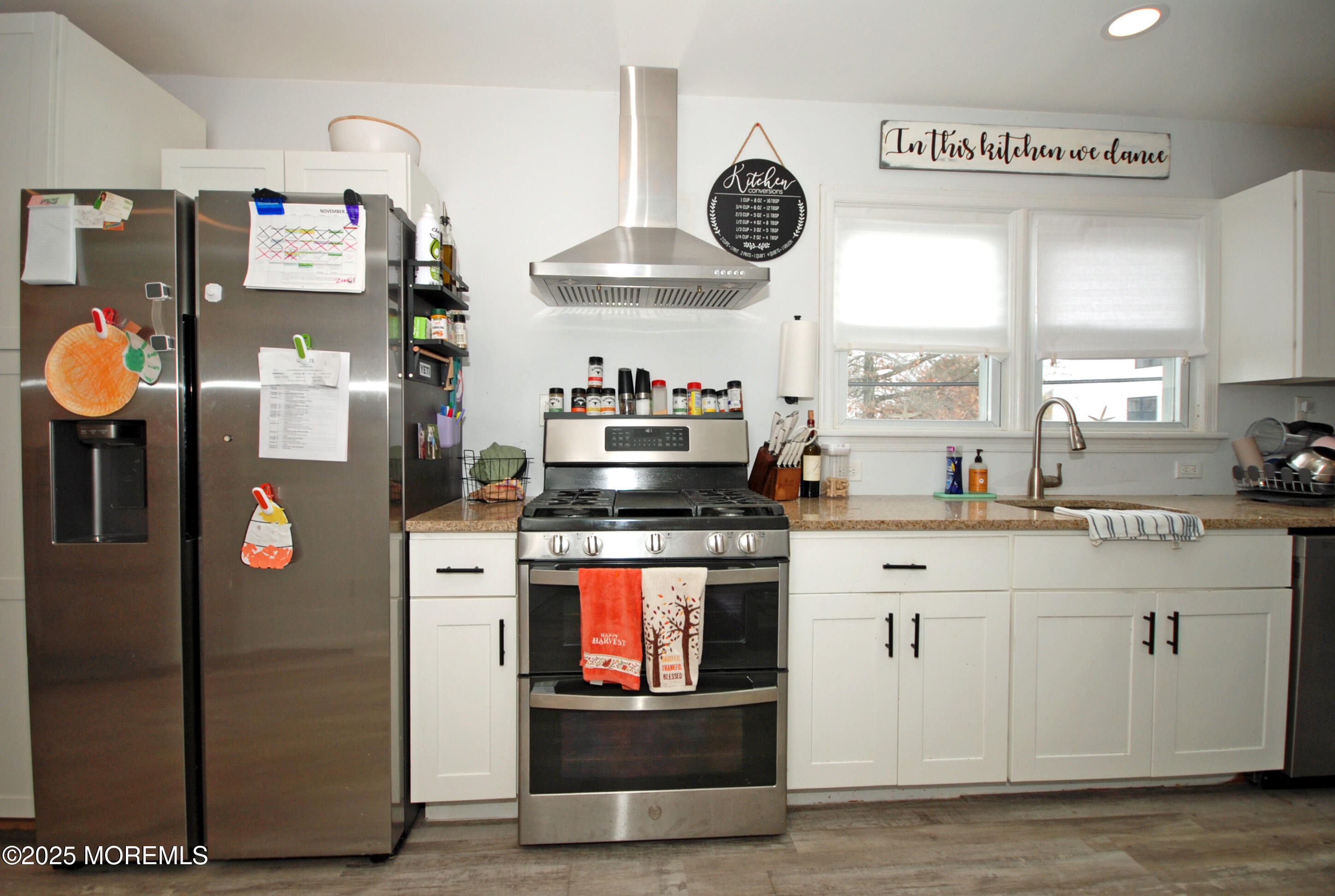 25 Beach Boulevard Highlands, NJ 07732 - Photo 15 of 32 a kitchen with stainless steel appliances granite countertop a stove and a sink