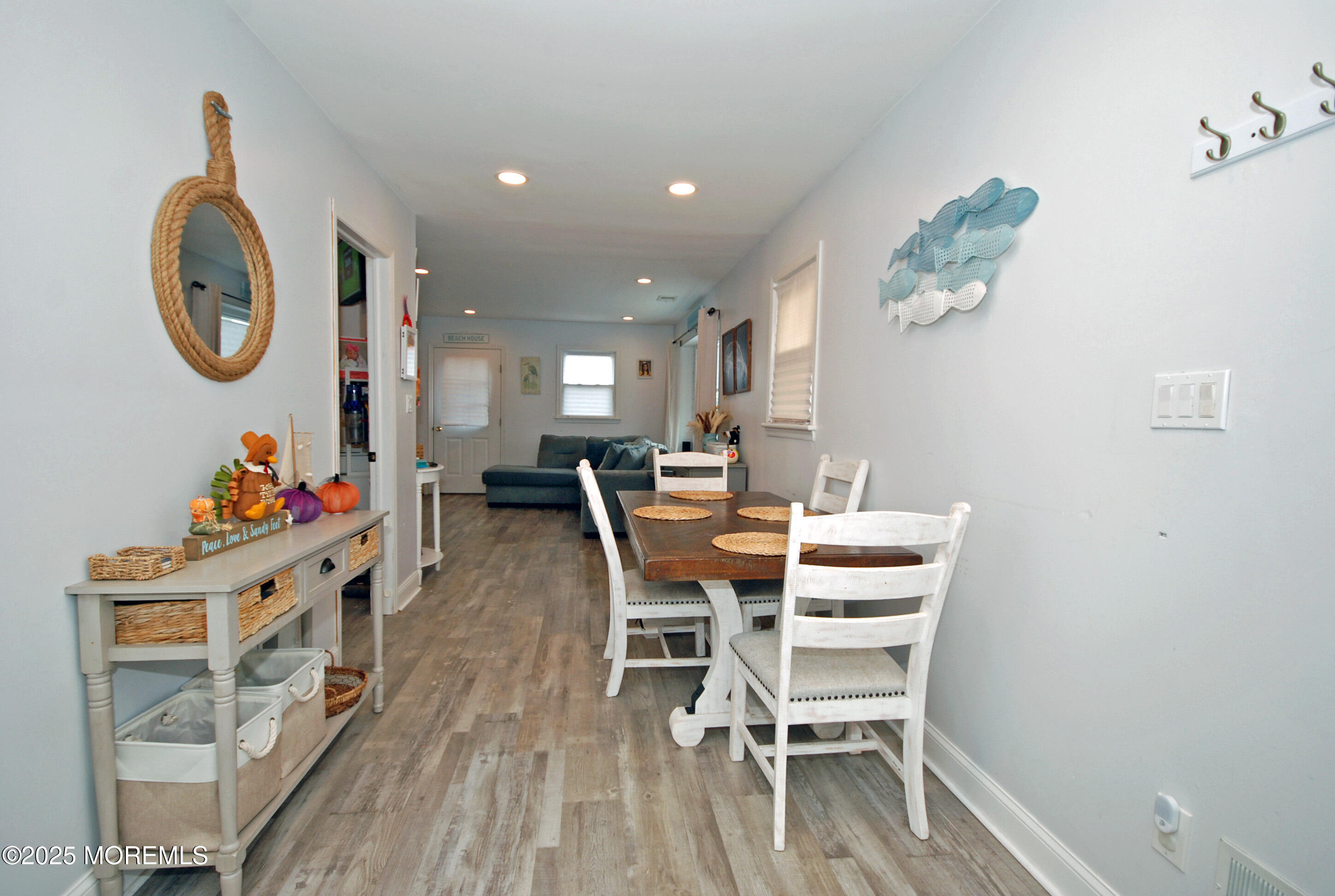 25 Beach Boulevard Highlands, NJ 07732 - Photo 16 of 32 a dining room with furniture and a wooden floor