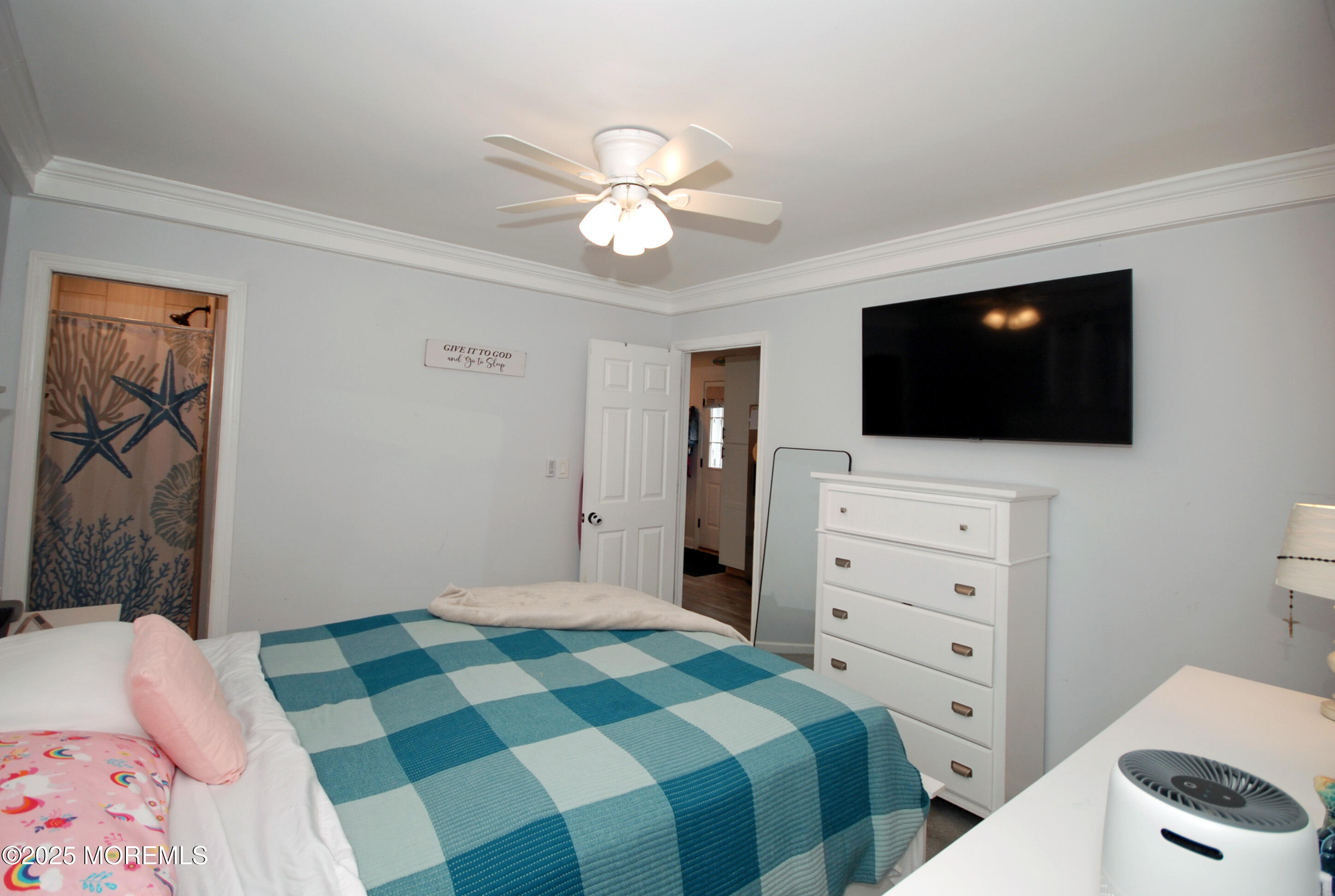 25 Beach Boulevard Highlands, NJ 07732 - Photo 22 of 32 a bedroom with a bed and a flat screen tv