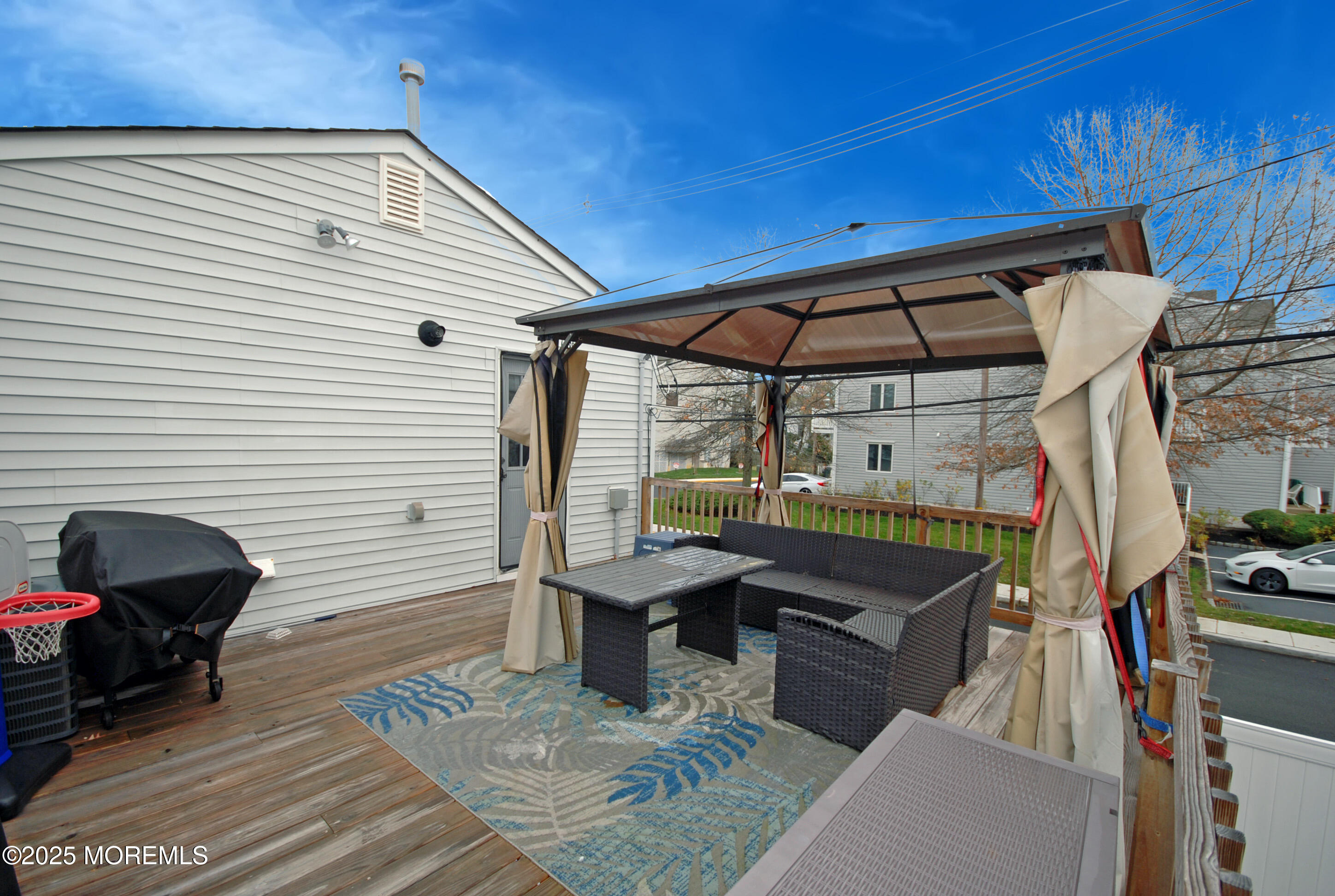 25 Beach Boulevard Highlands, NJ 07732 - Photo 30 of 32 a view of a patio with table and chairs under an umbrella