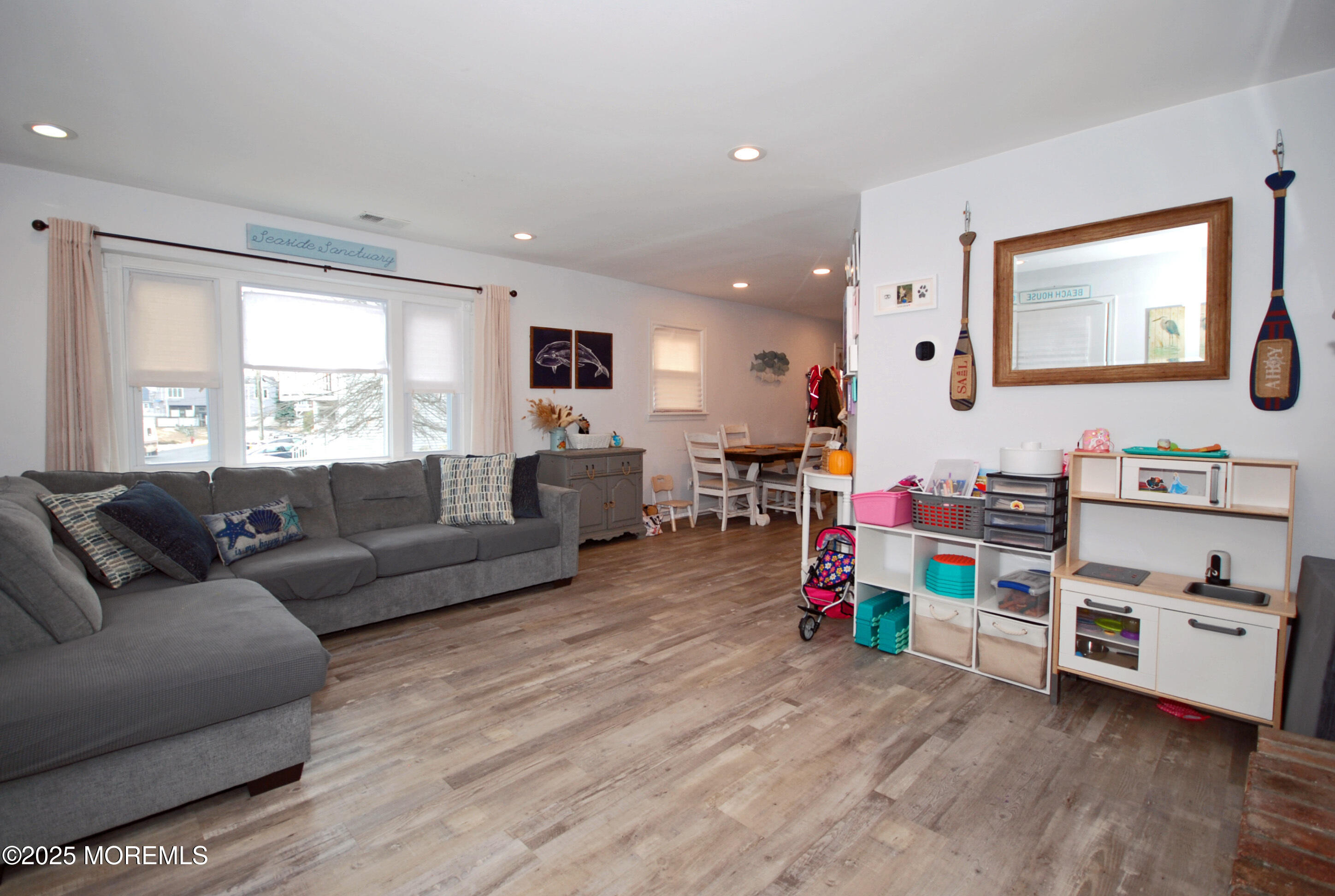 25 Beach Boulevard Highlands, NJ 07732 - Photo 7 of 32 a living room with furniture and a flat screen tv