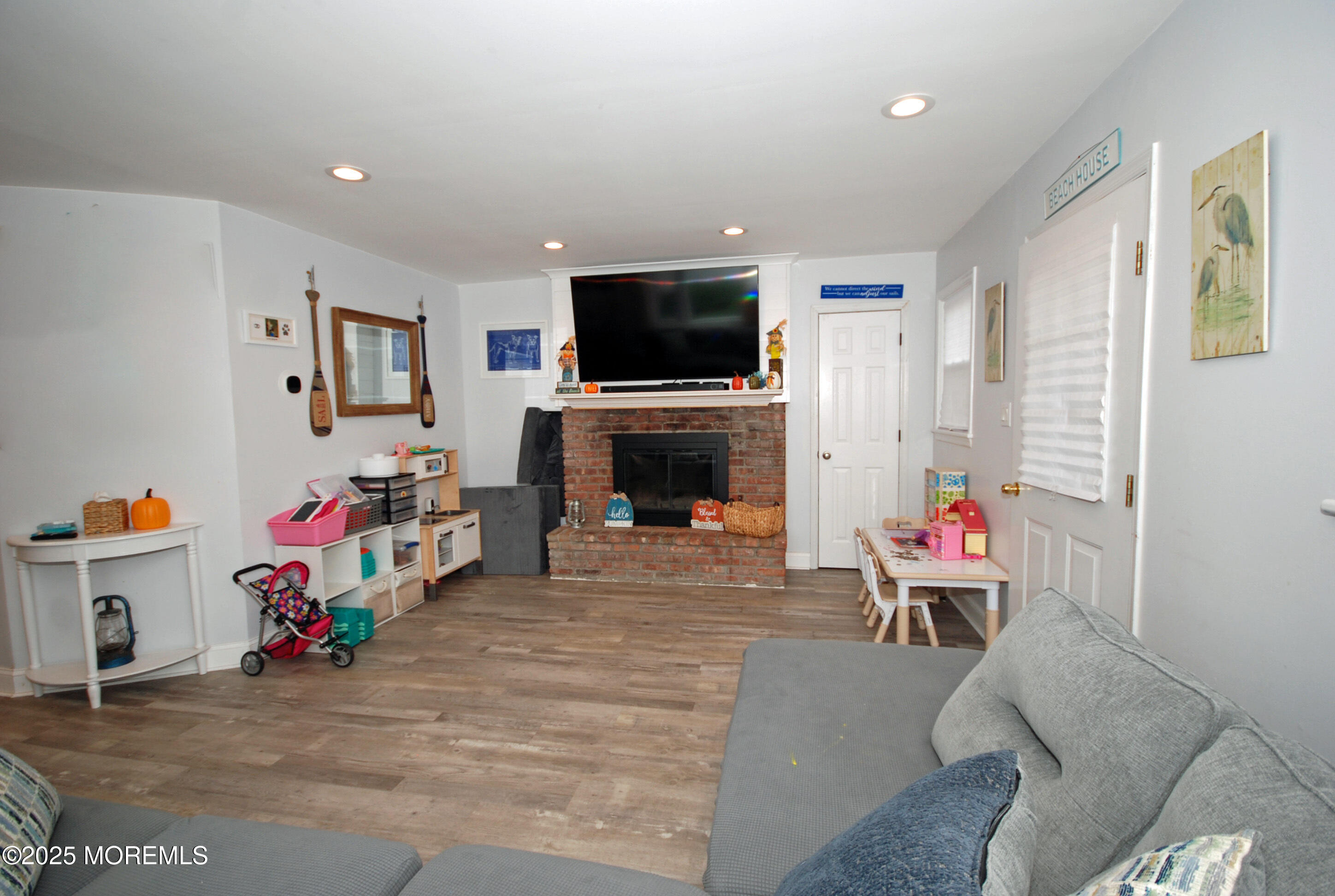 25 Beach Boulevard Highlands, NJ 07732 - Photo 9 of 32 a living room with furniture and a flat screen tv