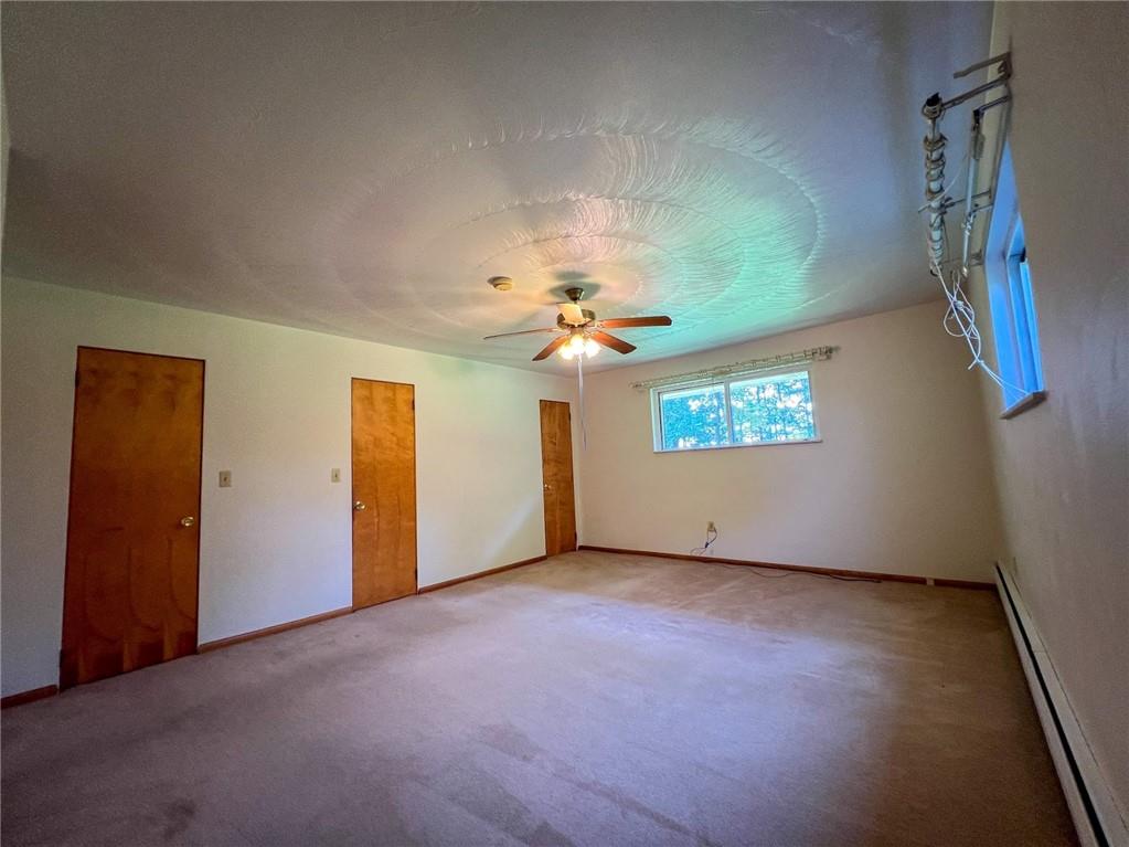 115 Grohman Road Butler, PA 16002 - Photo 23 of 39 an empty room with windows and fan
