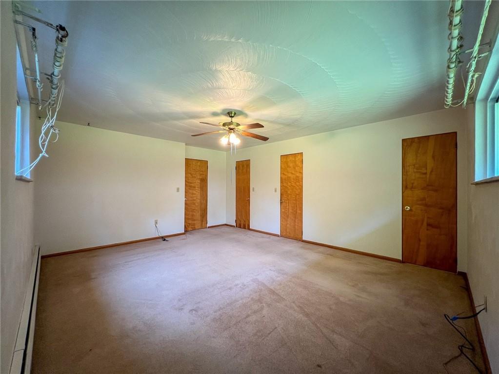 115 Grohman Road Butler, PA 16002 - Photo 24 of 39 an empty room with chandelier fan and windows