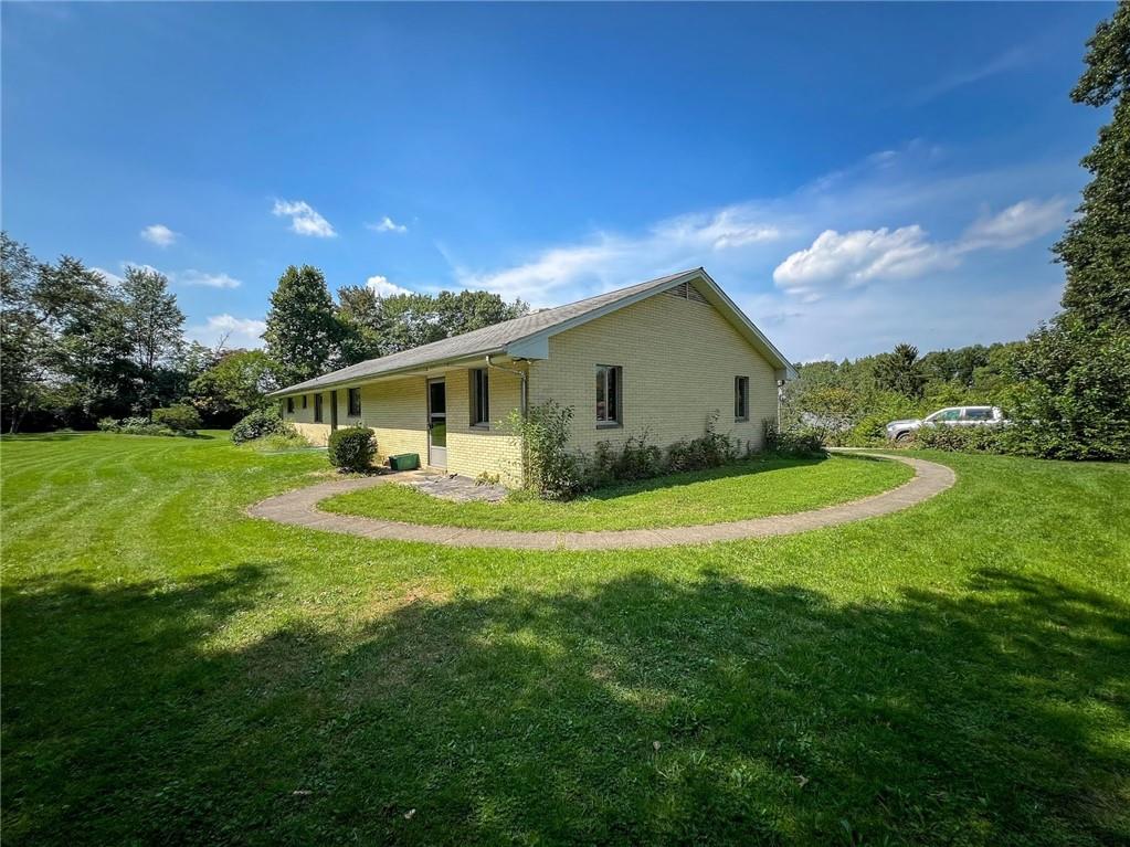 115 Grohman Road Butler, PA 16002 - Photo 35 of 39 a house view with swimming pool and garden