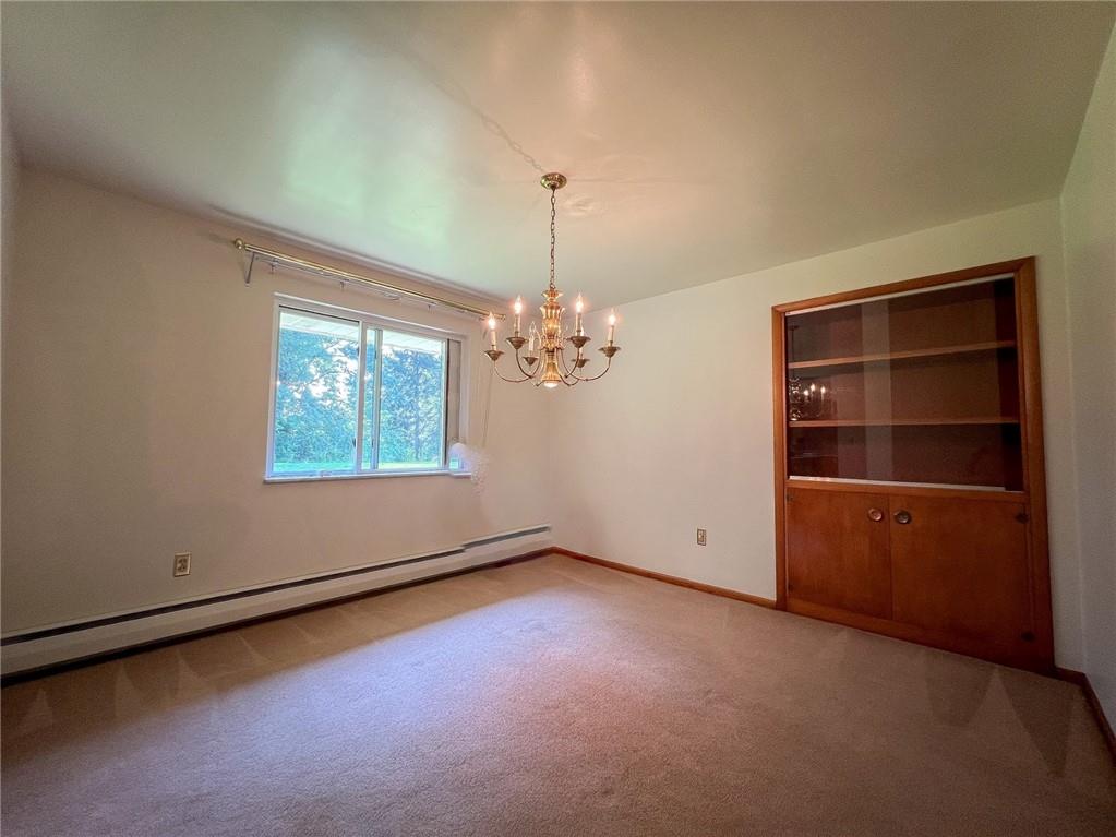 115 Grohman Road Butler, PA 16002 - Photo 9 of 39 an empty room with windows and cabinet