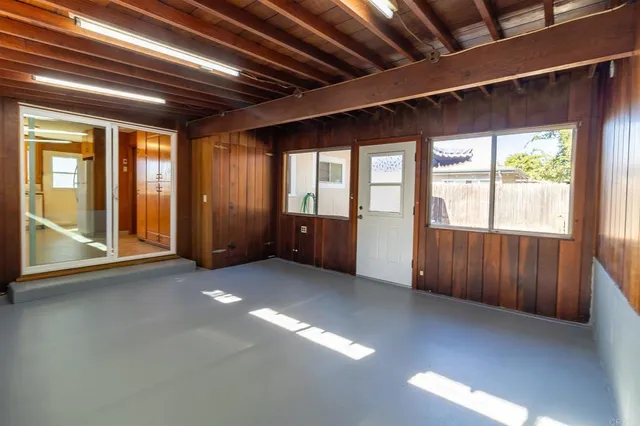 a view of a workspace with furniture and a potted plant
