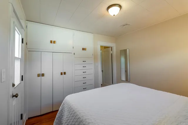 a front view of a house with glass windows and a table