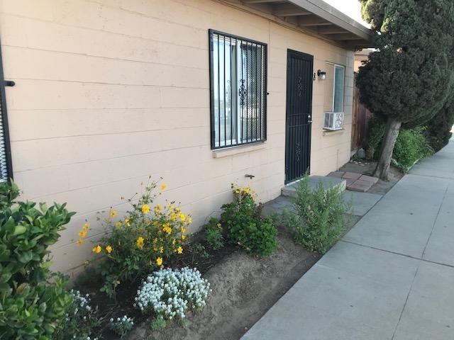809 South Maple Avenue Fresno, CA 93702 - Photo 1 of 4 a front view of a house with a yard