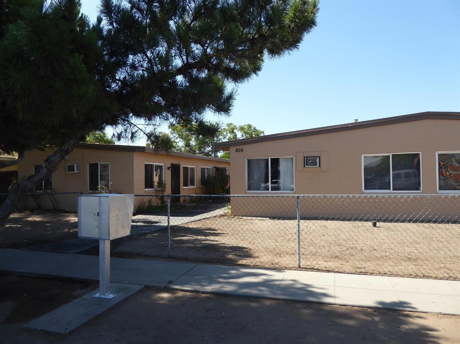 809 South Maple Avenue Fresno, CA 93702 - Photo 3 of 4 a front view of a house with a tree