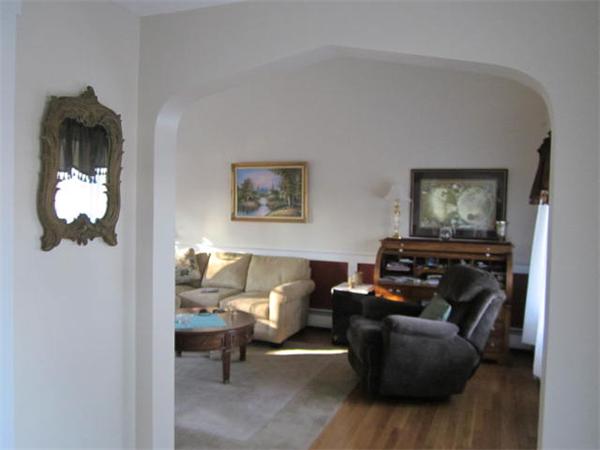541 Hatherly Road Scituate, MA 02066 - Photo 4 of 11 a living room with furniture and a mirror