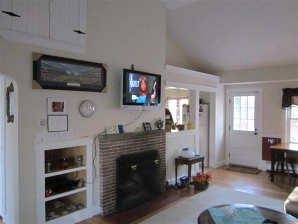 541 Hatherly Road Scituate, MA 02066 - Photo 5 of 11 a living room with furniture a flat screen tv and a fireplace