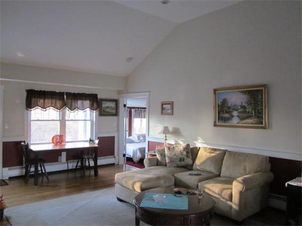 541 Hatherly Road Scituate, MA 02066 - Photo 6 of 11 a living room with furniture and a large window