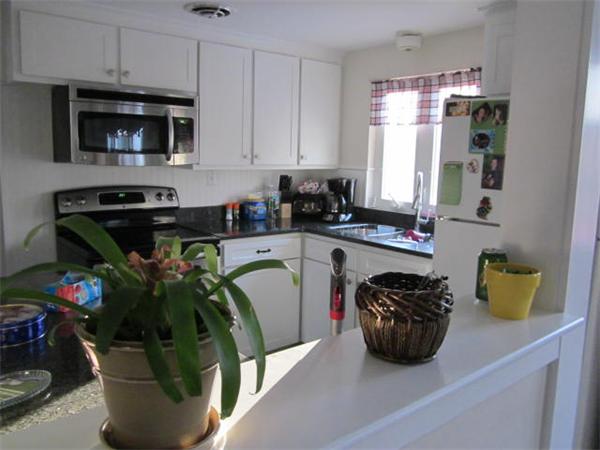 541 Hatherly Road Scituate, MA 02066 - Photo 7 of 11 a kitchen with a sink a counter appliances and cabinets