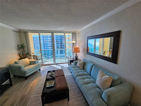 a living room with furniture and a large window