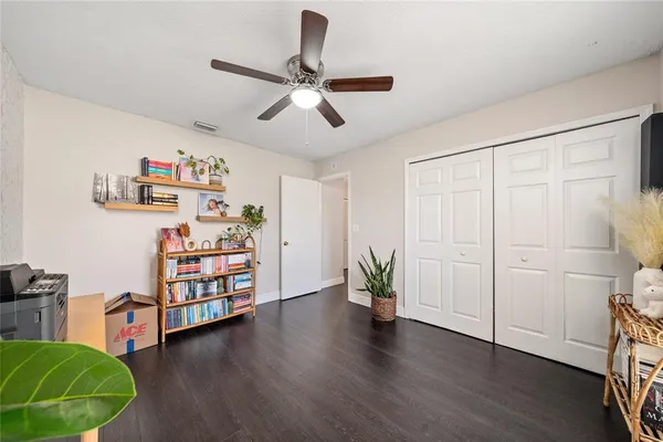 a view of a livingroom with furniture and wooden floor